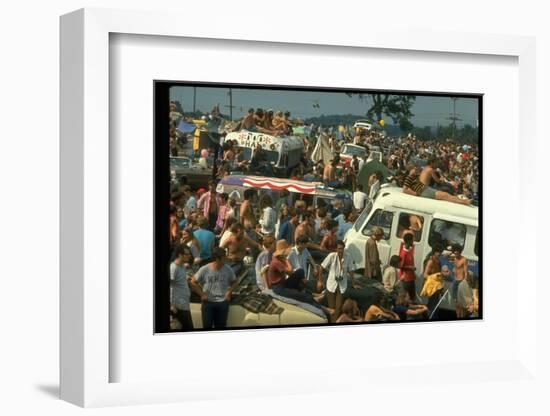 Crowd of people, some Sitting on Top of Cars and Busses, During the Woodstock Music/Art Fair-John Dominis-Framed Photographic Print