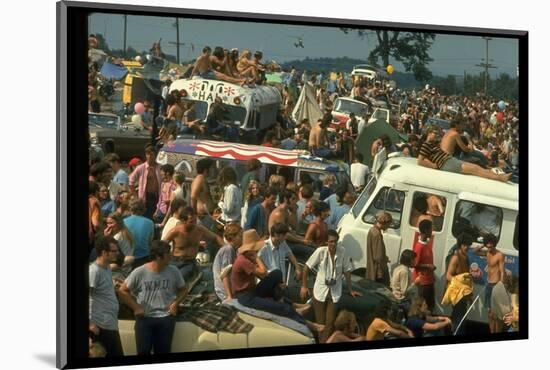 Crowd of people, some Sitting on Top of Cars and Busses, During the Woodstock Music/Art Fair-John Dominis-Mounted Photographic Print