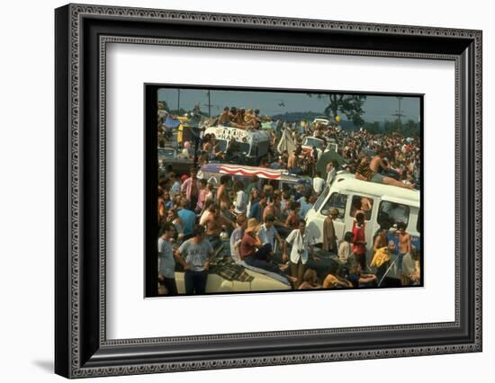 Crowd of people, some Sitting on Top of Cars and Busses, During the Woodstock Music/Art Fair-John Dominis-Framed Photographic Print