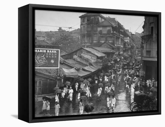 Crowds under Umbrellas on Street Outside Bombay Cotton Exchange During Monsoon Season-Margaret Bourke-White-Framed Premier Image Canvas