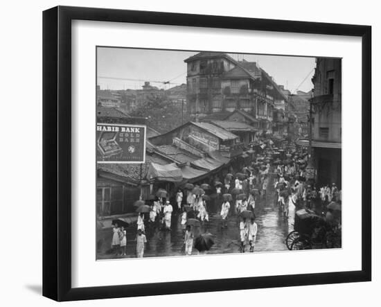 Crowds under Umbrellas on Street Outside Bombay Cotton Exchange During Monsoon Season-Margaret Bourke-White-Framed Photographic Print