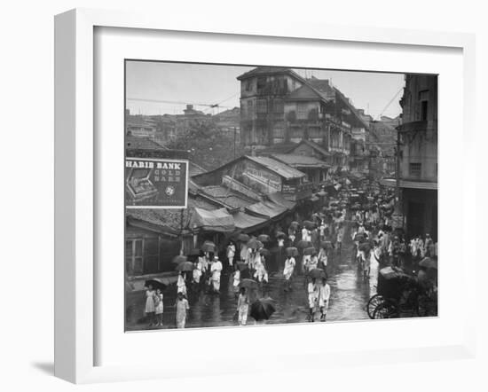 Crowds under Umbrellas on Street Outside Bombay Cotton Exchange During Monsoon Season-Margaret Bourke-White-Framed Photographic Print