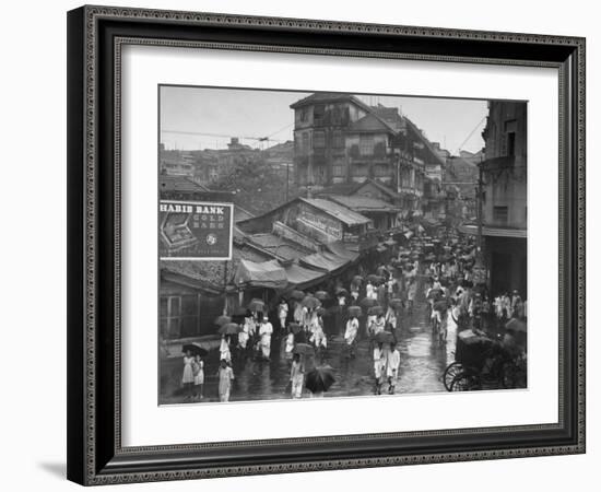 Crowds under Umbrellas on Street Outside Bombay Cotton Exchange During Monsoon Season-Margaret Bourke-White-Framed Photographic Print