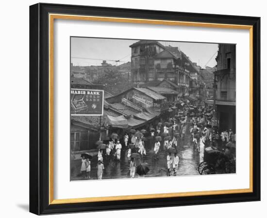 Crowds under Umbrellas on Street Outside Bombay Cotton Exchange During Monsoon Season-Margaret Bourke-White-Framed Photographic Print
