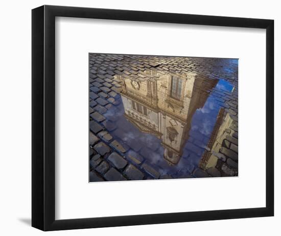 Cuba, Havana, Havana Vieja, reflection of historic building in puddle on cobblestone street.-Merrill Images-Framed Photographic Print