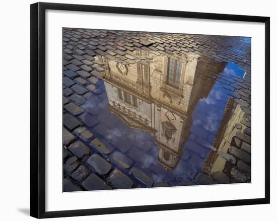 Cuba, Havana, Havana Vieja, reflection of historic building in puddle on cobblestone street.-Merrill Images-Framed Photographic Print