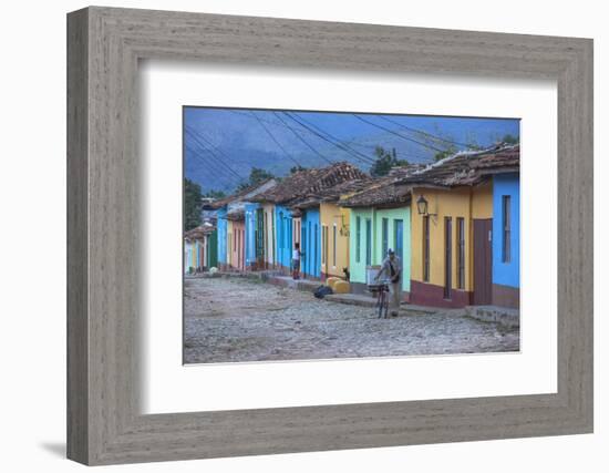 Cuba, Trinidad, a Man Selling Sandwiches Up a Colourful Street in Historical Center-Jane Sweeney-Framed Photographic Print