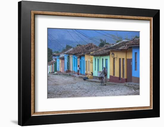 Cuba, Trinidad, a Man Selling Sandwiches Up a Colourful Street in Historical Center-Jane Sweeney-Framed Photographic Print