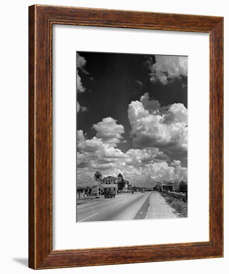 Cumulus Clouds Billowing over Texaco Gas Station along a Stretch of Highway US 66-Andreas Feininger-Framed Premium Photographic Print