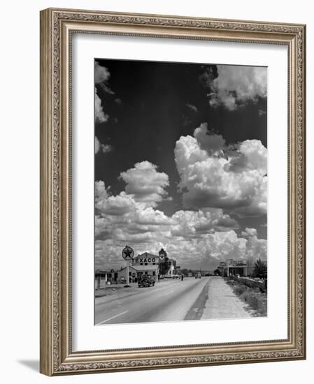 Cumulus Clouds Billowing over Texaco Gas Station along a Stretch of Highway US 66-Andreas Feininger-Framed Photographic Print