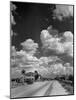 Cumulus Clouds Billowing over Texaco Gas Station along a Stretch of Highway US 66-Andreas Feininger-Mounted Photographic Print