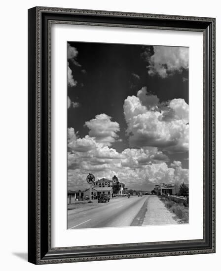 Cumulus Clouds Billowing over Texaco Gas Station along a Stretch of Highway US 66-Andreas Feininger-Framed Photographic Print