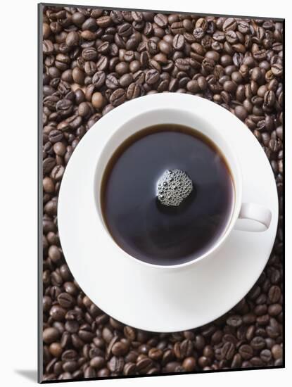 Cup of Black Coffee on Coffee Beans-null-Mounted Photographic Print