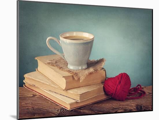 Cup of Coffee Standing on Old Books and Wool Heart-egal-Mounted Photographic Print