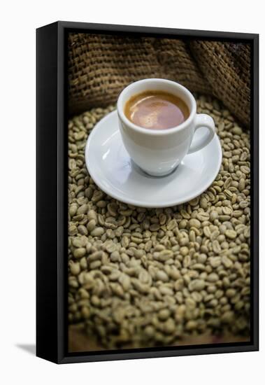 Cup of Espresso on a Sack with Unroasted Coffee Beans-Bernd Wittelsbach-Framed Premier Image Canvas