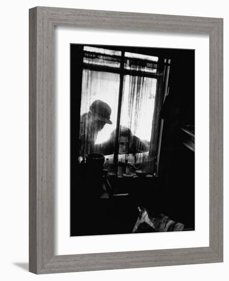 Curiosity Seekers Peering Into Kitchen Window at Alleged Mass Murderer Ed Gein's House-Frank Scherschel-Framed Photographic Print