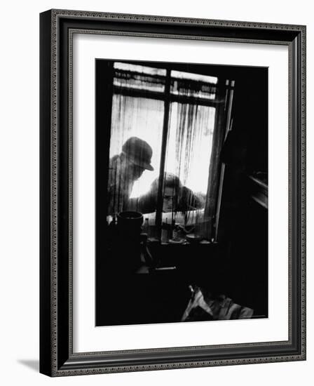 Curiosity Seekers Peering Into Kitchen Window at Alleged Mass Murderer Ed Gein's House-Frank Scherschel-Framed Photographic Print