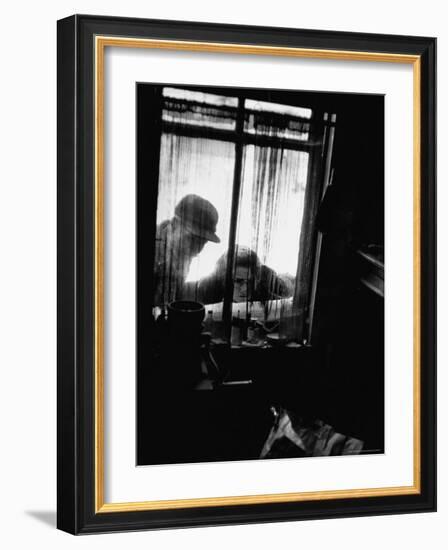 Curiosity Seekers Peering Into Kitchen Window at Alleged Mass Murderer Ed Gein's House-Frank Scherschel-Framed Photographic Print