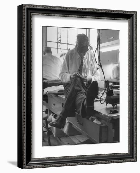 Custom Tailor Ernest Preedik Sitting on Table and Working in Factory-Ralph Morse-Framed Photographic Print