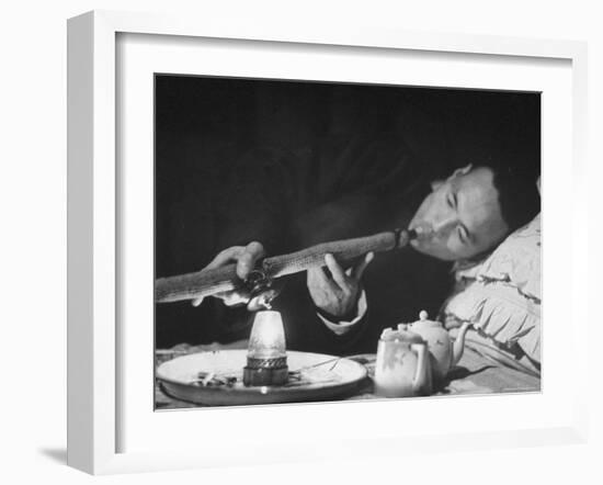 Customer Smoking Opium in an Opium Den-George Lacks-Framed Photographic Print