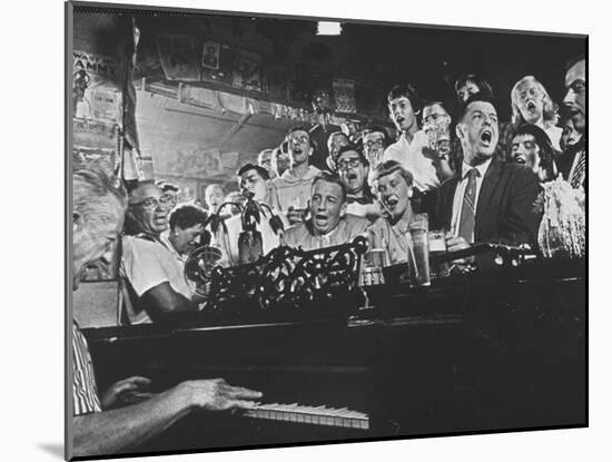 Customers at Bar of Casey's Limestone House Join in Singing Old Songs-Yale Joel-Mounted Photographic Print