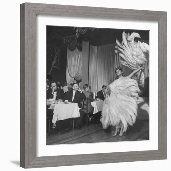 Customers at Sally Rand's Nightclub Watching a Dancer Performing the Midnight Fan Dance-Charles E^ Steinheimer-Framed Premium Photographic Print