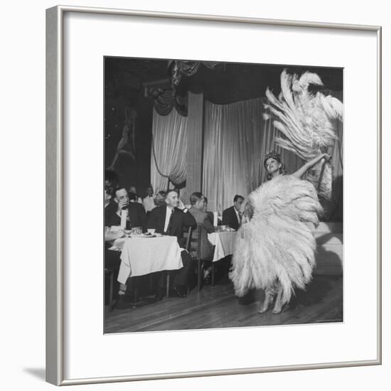 Customers at Sally Rand's Nightclub Watching a Dancer Performing the Midnight Fan Dance-Charles E^ Steinheimer-Framed Premium Photographic Print