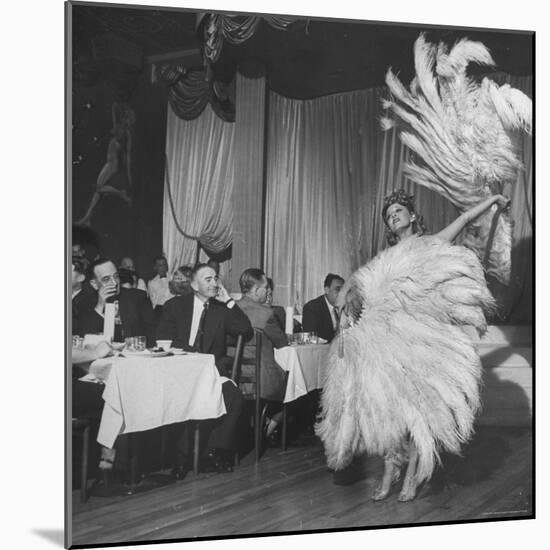 Customers at Sally Rand's Nightclub Watching a Dancer Performing the Midnight Fan Dance-Charles E^ Steinheimer-Mounted Premium Photographic Print