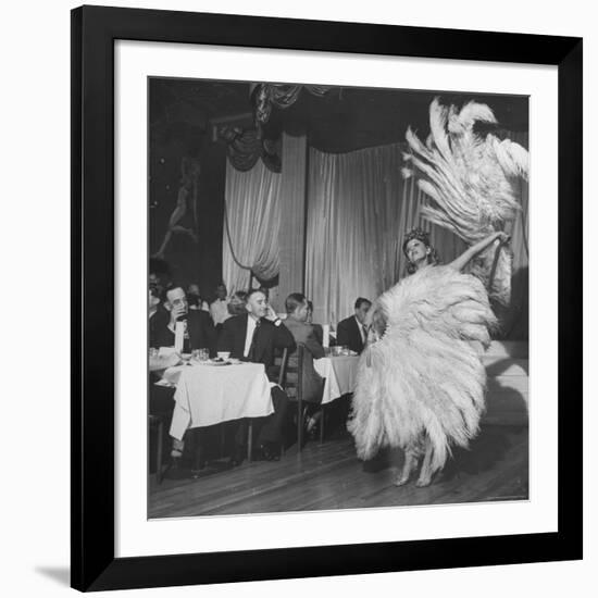 Customers at Sally Rand's Nightclub Watching a Dancer Performing the Midnight Fan Dance-Charles E^ Steinheimer-Framed Premium Photographic Print