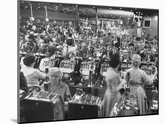 Customers at Slot Machines at Harrah's Nightclub-Nat Farbman-Mounted Photographic Print