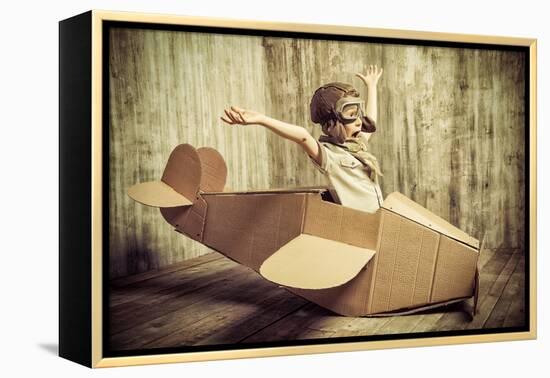 Cute Dreamer Boy Playing with a Cardboard Airplane. Childhood. Fantasy, Imagination. Retro Style.-prometeus-Framed Premier Image Canvas