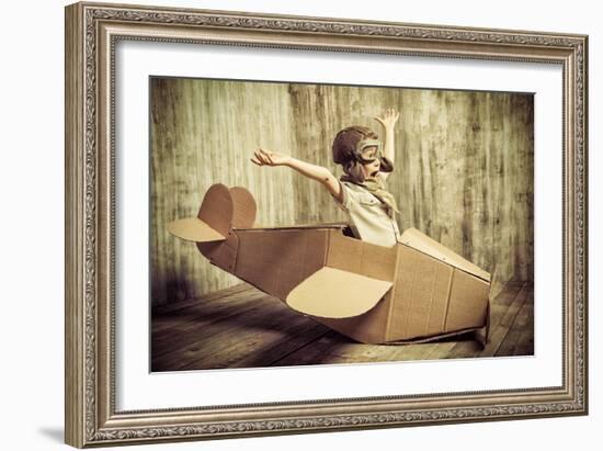 Cute Dreamer Boy Playing with a Cardboard Airplane. Childhood. Fantasy, Imagination. Retro Style.-prometeus-Framed Photographic Print