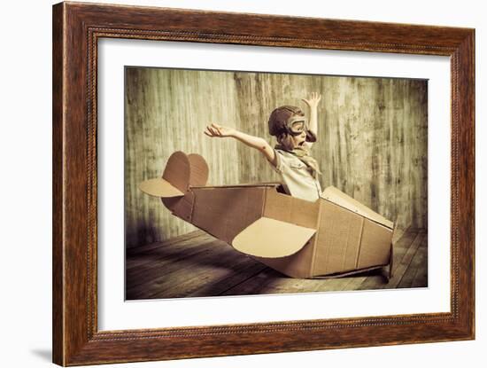 Cute Dreamer Boy Playing with a Cardboard Airplane. Childhood. Fantasy, Imagination. Retro Style.-prometeus-Framed Photographic Print