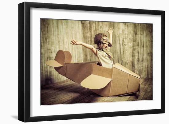 Cute Dreamer Boy Playing with a Cardboard Airplane. Childhood. Fantasy, Imagination. Retro Style.-prometeus-Framed Photographic Print