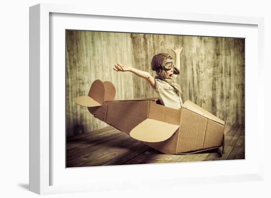 Cute Dreamer Boy Playing with a Cardboard Airplane. Childhood. Fantasy, Imagination. Retro Style.-prometeus-Framed Photographic Print