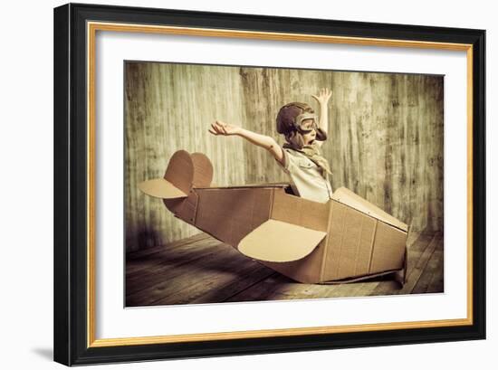 Cute Dreamer Boy Playing with a Cardboard Airplane. Childhood. Fantasy, Imagination. Retro Style.-prometeus-Framed Photographic Print