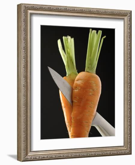 Cutting a Carrot in Half with a Knife-Vladimir Shulevsky-Framed Photographic Print