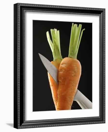 Cutting a Carrot in Half with a Knife-Vladimir Shulevsky-Framed Photographic Print