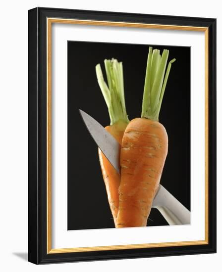 Cutting a Carrot in Half with a Knife-Vladimir Shulevsky-Framed Photographic Print