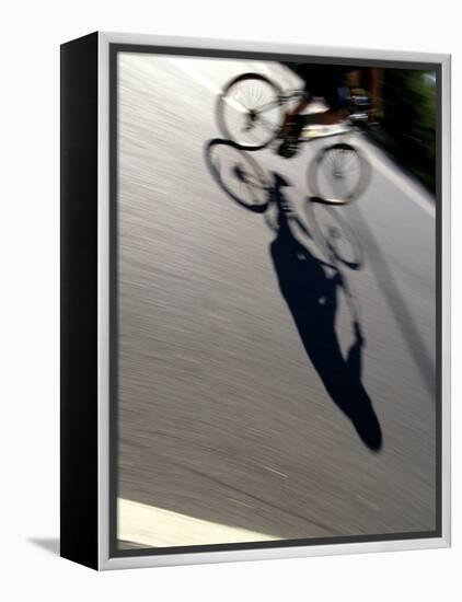 Cyclist and His Shadow-Chris Trotman-Framed Premier Image Canvas