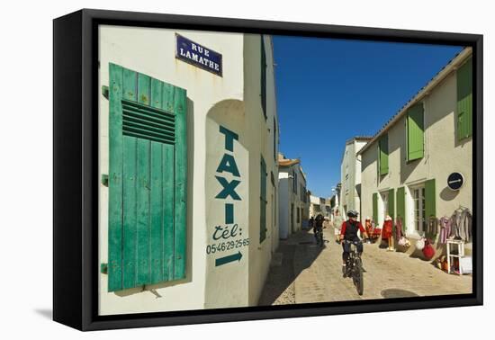 Cyclist on Rue Lamathe in the island's principal western town, Ars en Re, Ile de Re, Charente-Marit-Robert Francis-Framed Premier Image Canvas