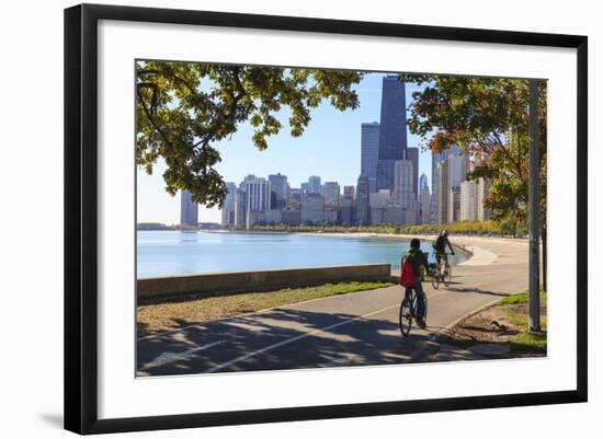 Cyclists Riding Along Lake Michigan Shore with the Chicago Skyline Beyond, Chicago, Illinois, USA-Amanda Hall-Framed Photographic Print