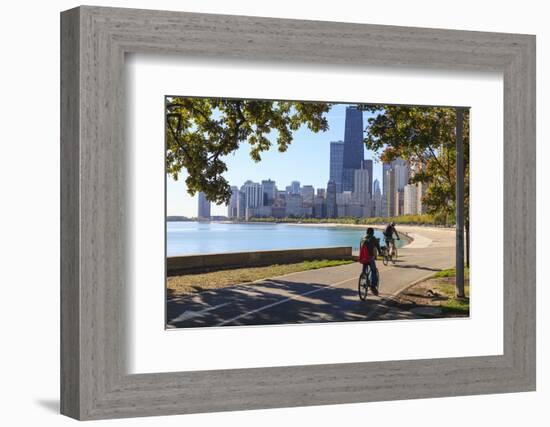 Cyclists Riding Along Lake Michigan Shore with the Chicago Skyline Beyond, Chicago, Illinois, USA-Amanda Hall-Framed Photographic Print