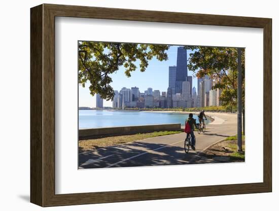 Cyclists Riding Along Lake Michigan Shore with the Chicago Skyline Beyond, Chicago, Illinois, USA-Amanda Hall-Framed Photographic Print