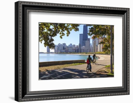 Cyclists Riding Along Lake Michigan Shore with the Chicago Skyline Beyond, Chicago, Illinois, USA-Amanda Hall-Framed Photographic Print