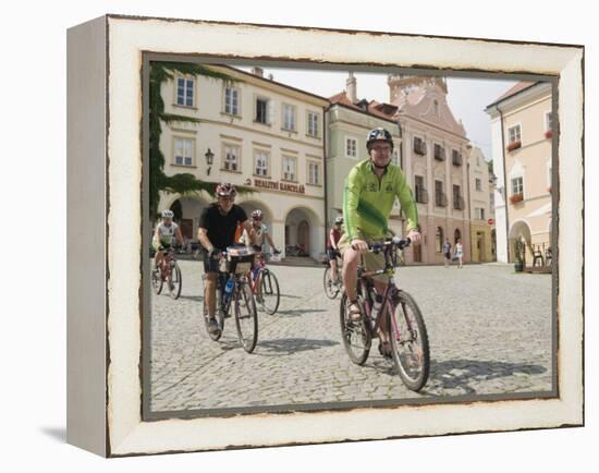 Cyclists Riding Through Namesti in Town of Mikulov, Brnensko Region-Richard Nebesky-Framed Premier Image Canvas