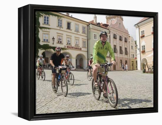 Cyclists Riding Through Namesti in Town of Mikulov, Brnensko Region-Richard Nebesky-Framed Premier Image Canvas