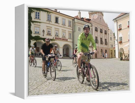 Cyclists Riding Through Namesti in Town of Mikulov, Brnensko Region-Richard Nebesky-Framed Premier Image Canvas