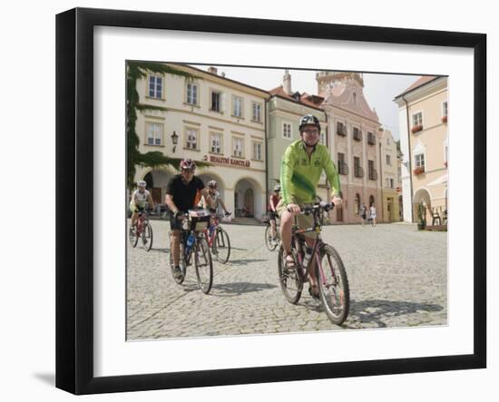 Cyclists Riding Through Namesti in Town of Mikulov, Brnensko Region-Richard Nebesky-Framed Photographic Print