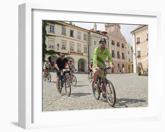 Cyclists Riding Through Namesti in Town of Mikulov, Brnensko Region-Richard Nebesky-Framed Photographic Print